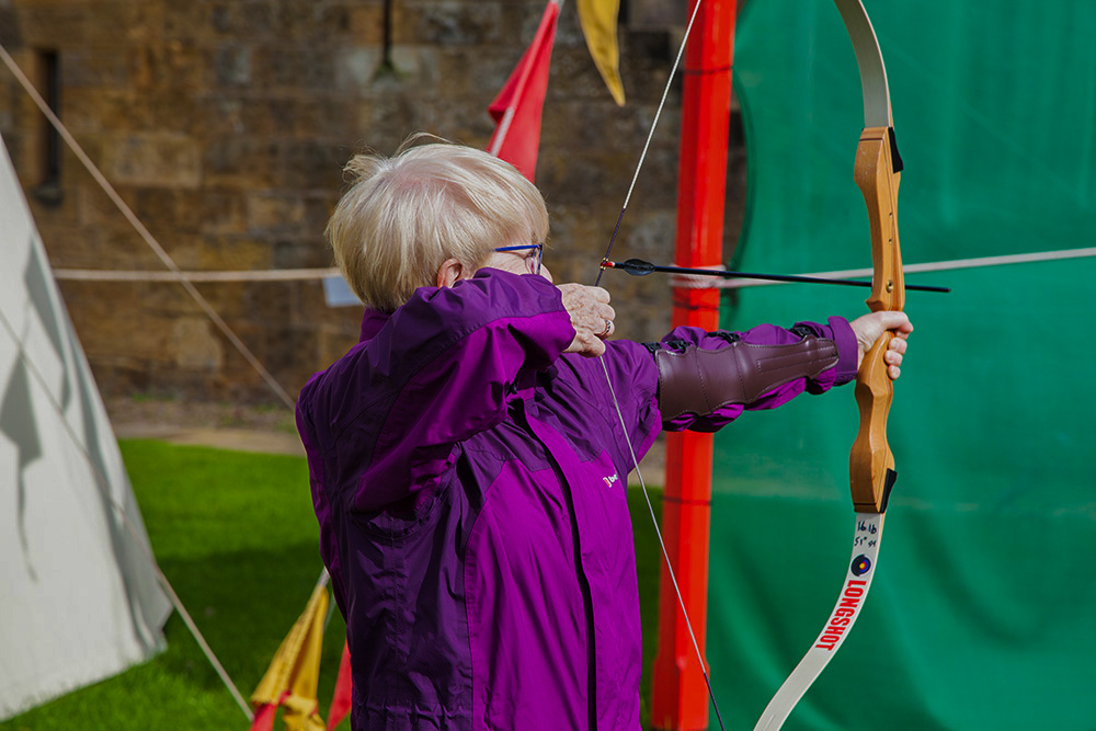 pat doing archery at alnwick castle